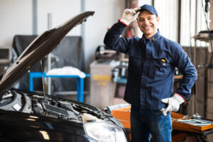 Auto repair mechanic smiling at Framerite Auto Repair in Baltimore, Maryland.